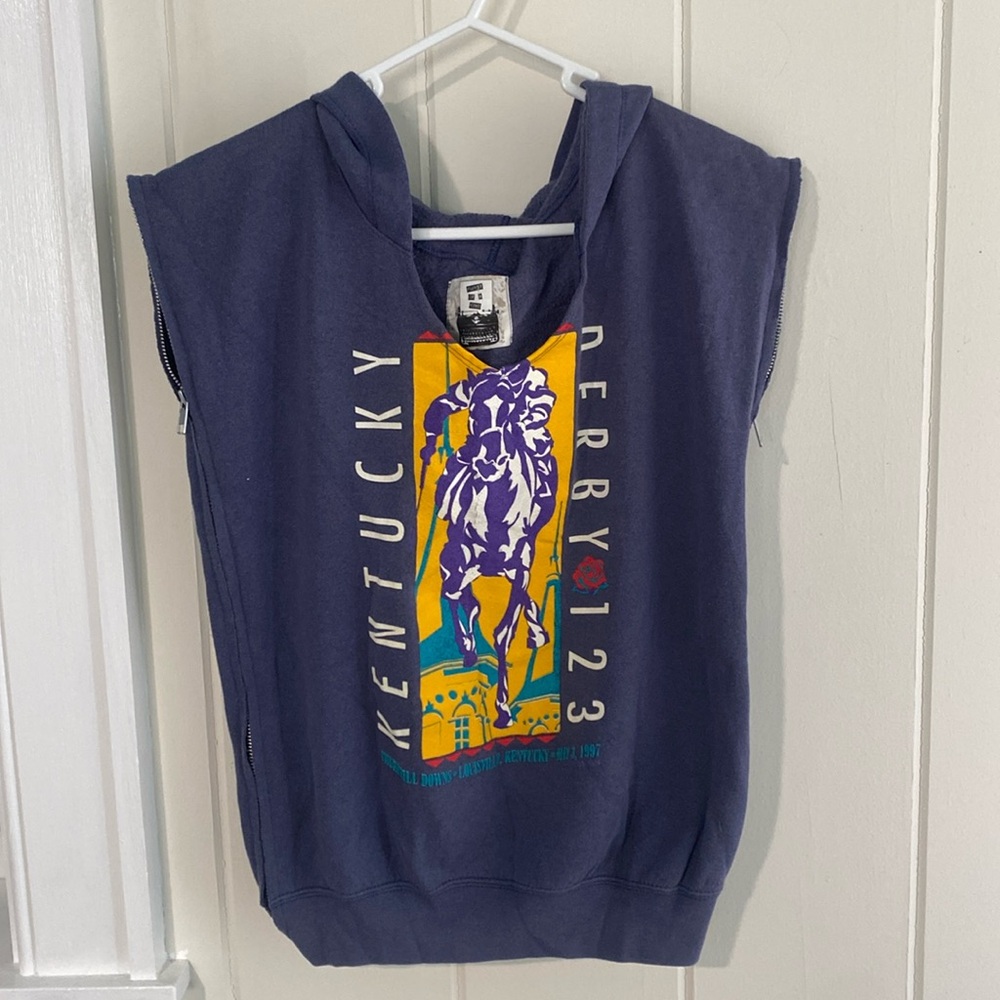 Blue hooded sleeveless sweatshirt.